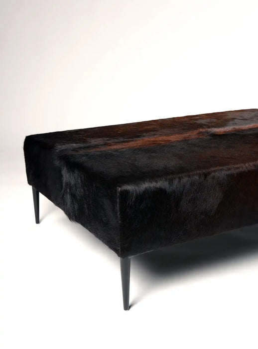 Dark cowhide ottoman black metal legs