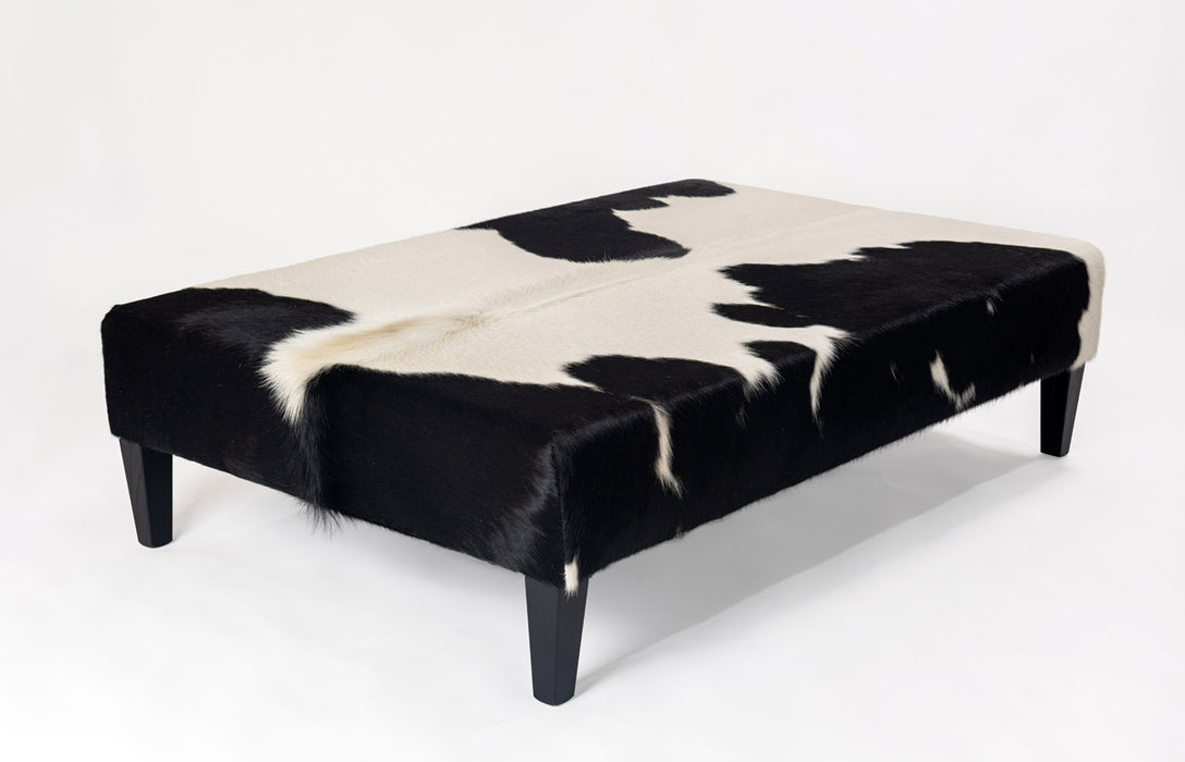 Very large black and white cowhide ottoman